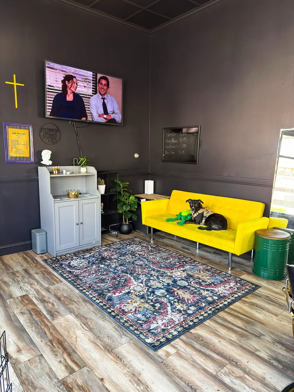 The mustard sofa in the lounge — shop dog on duty